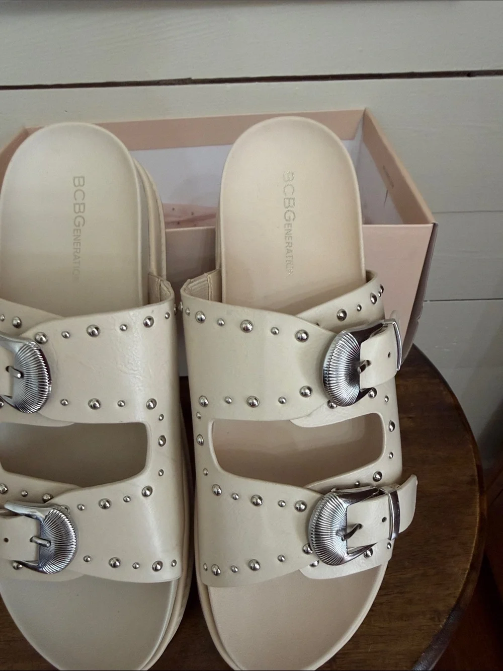 BCBGeneration Ivory Slide Sandals with Silver Buckles